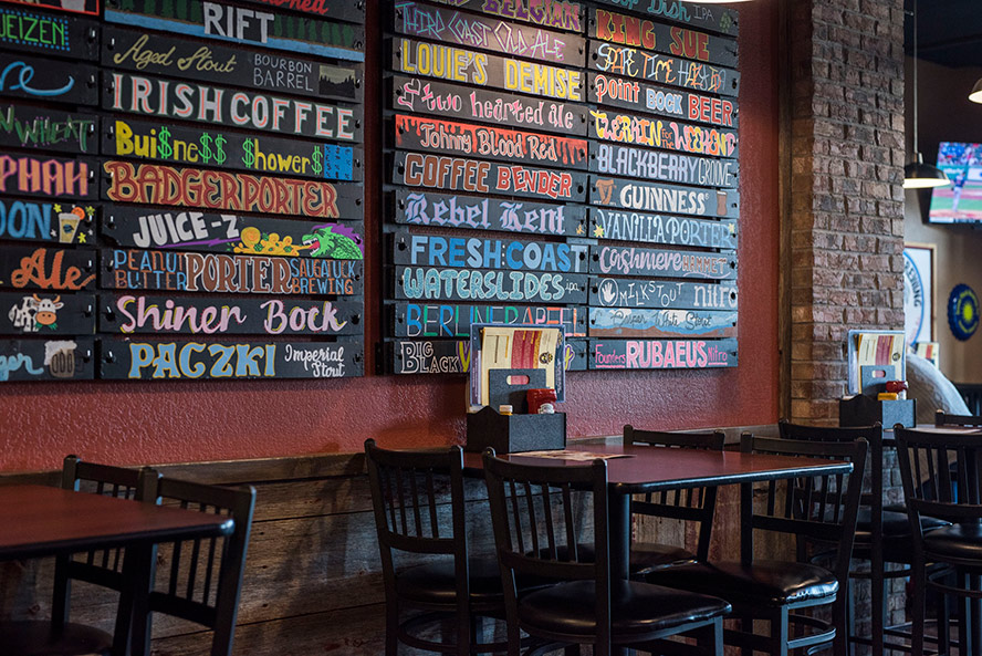 restaurant interior with the artistic menu on the wall